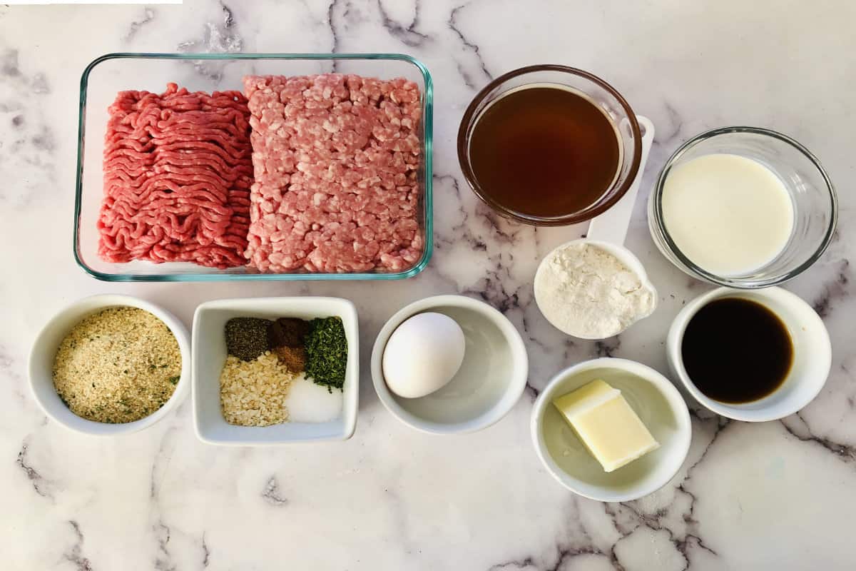 ground beef, ground pork, and seasonings for making meatballs.