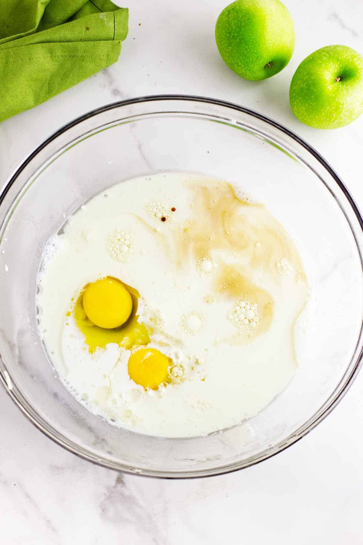 eggs, milk, and vanilla in a bowl.