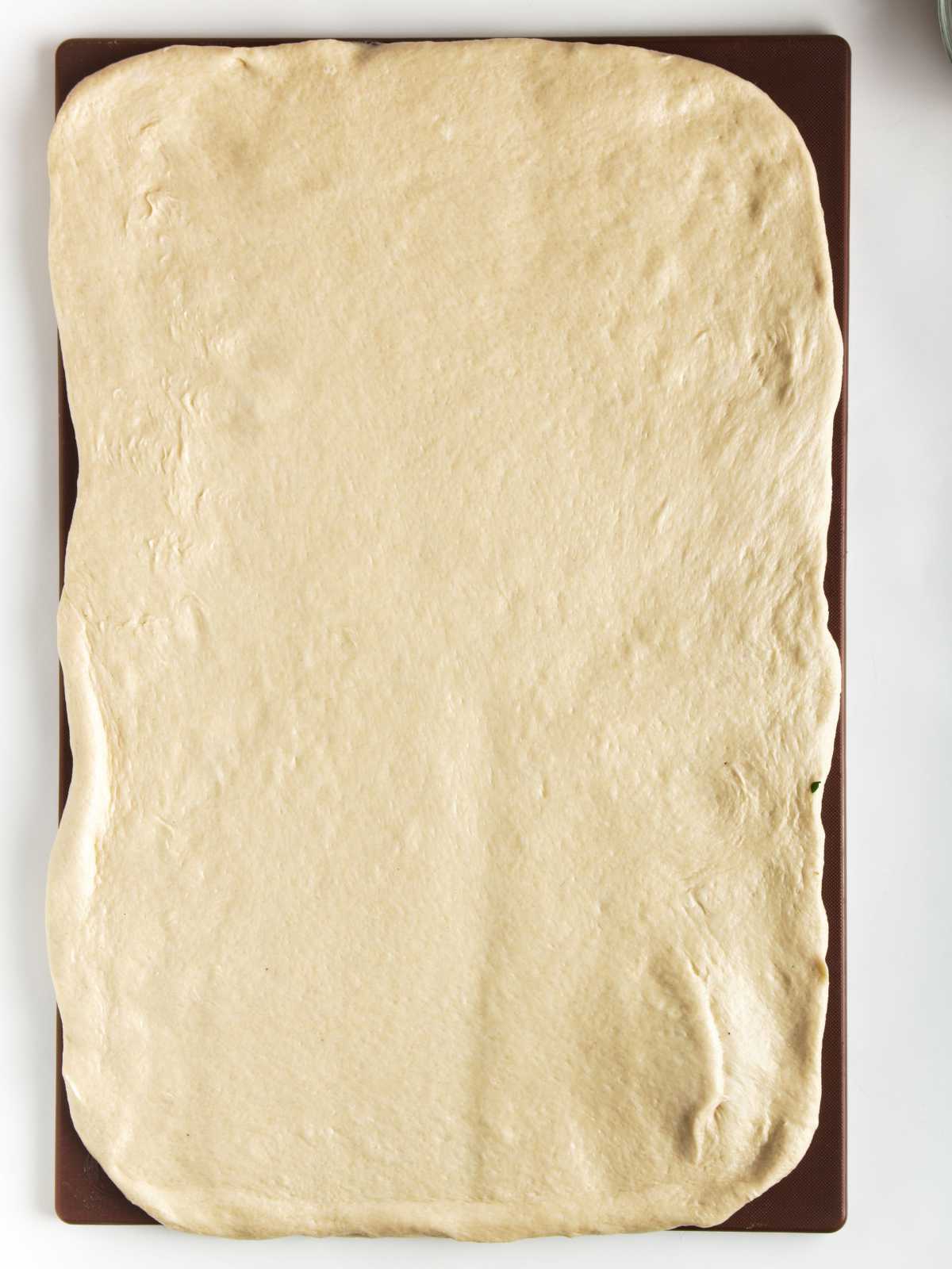 dough rolled out into a large rectangle.