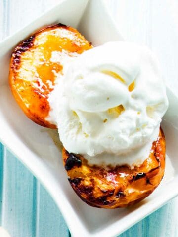 Roasted peaches, with brown sugar ,pistacchio and cinnamon, topped with vanilla ice cream.