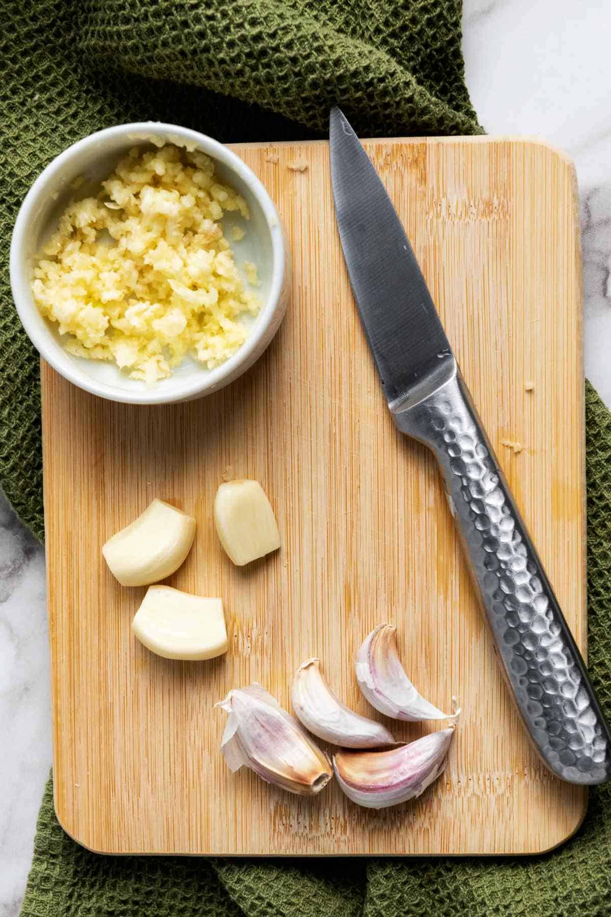 minced garlic on a cutting board.