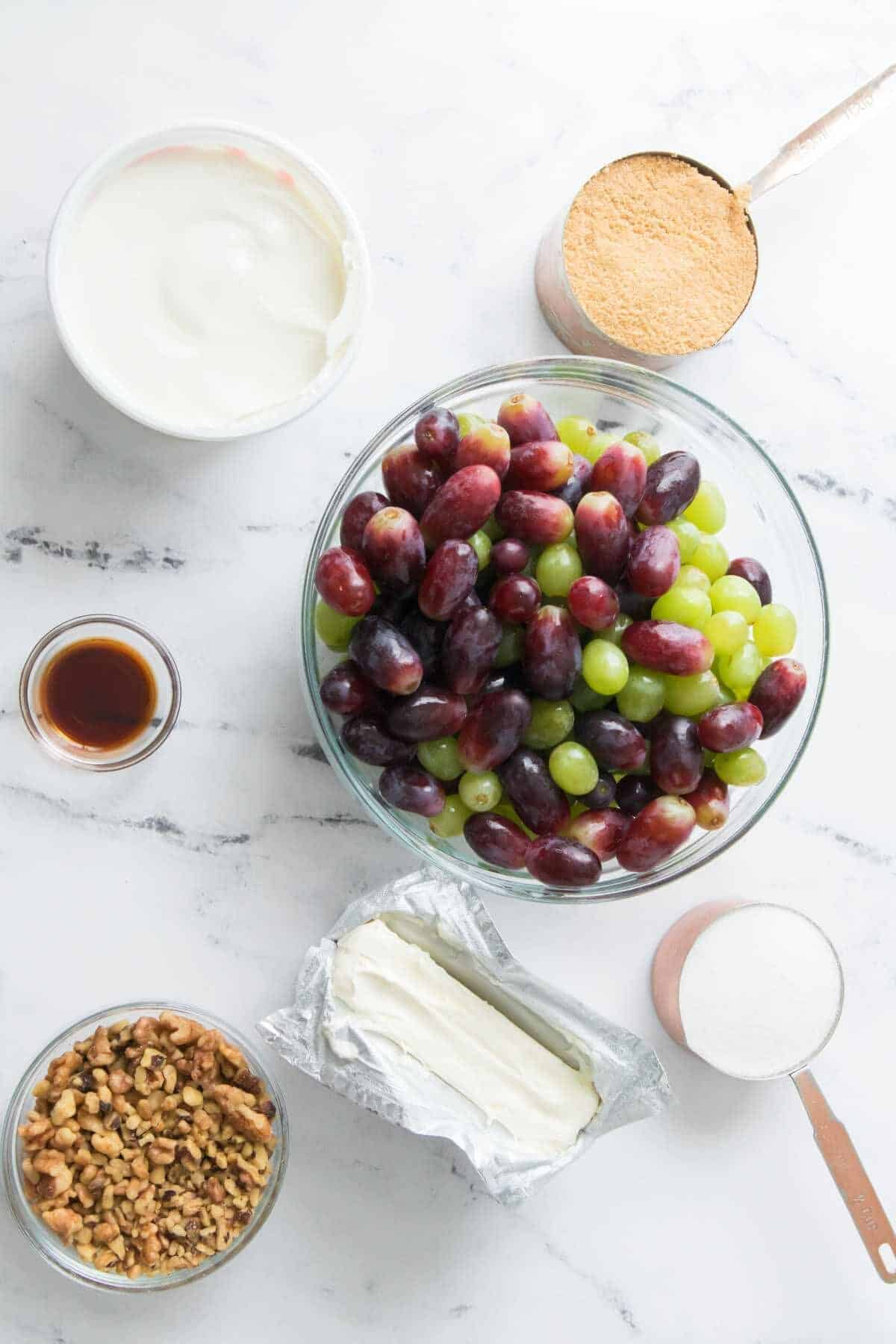 bowls of cream cheese, sour cream, sugar, walnuts, brown sugar, vanilla, and fruit.