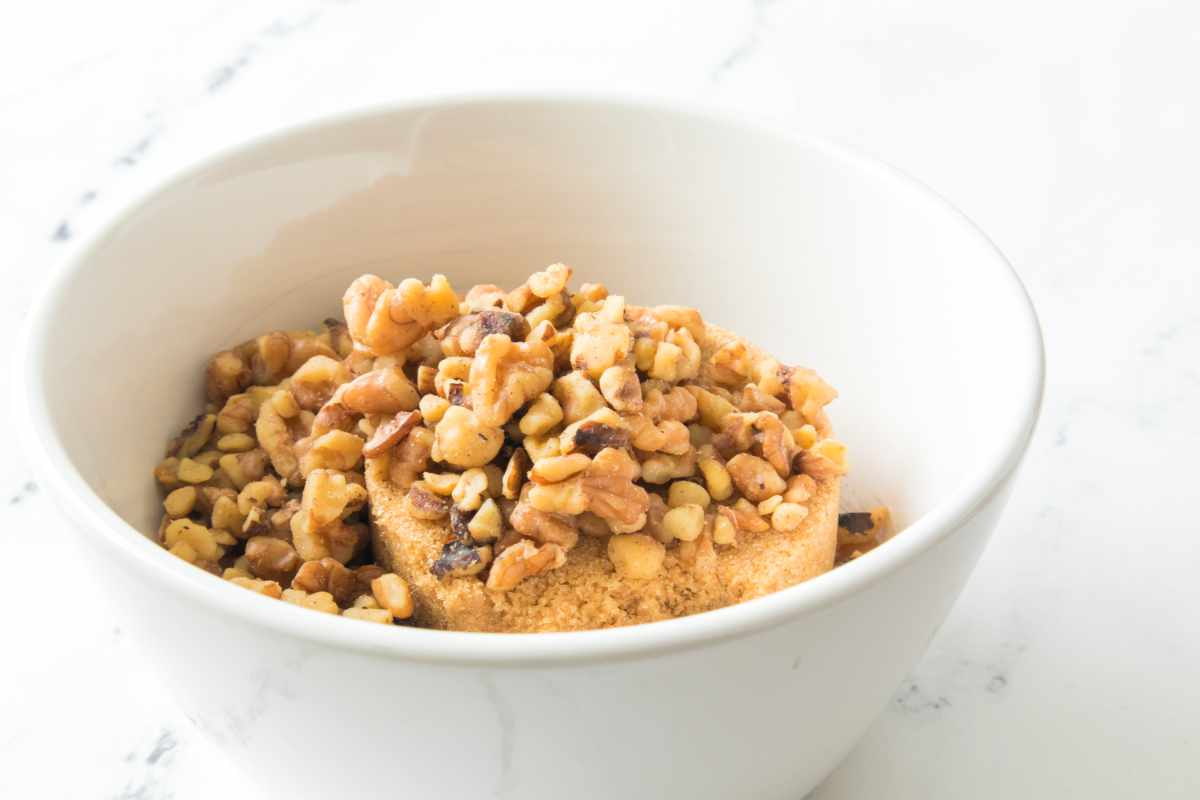 bowl of brown sugar and chopped walnuts for dessert salad topping.