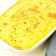 casserole dish of browned yellow grits