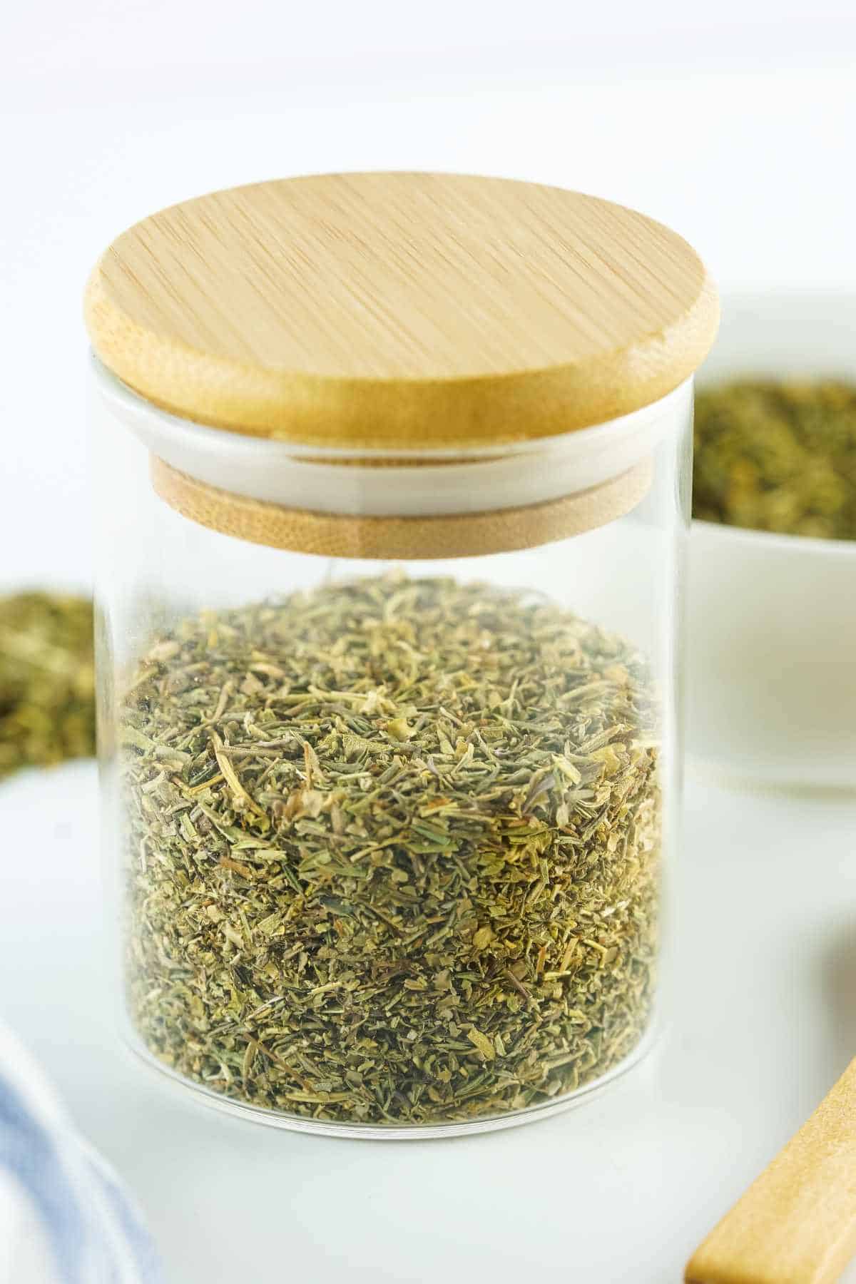 jar of herbes de provence on a white background.