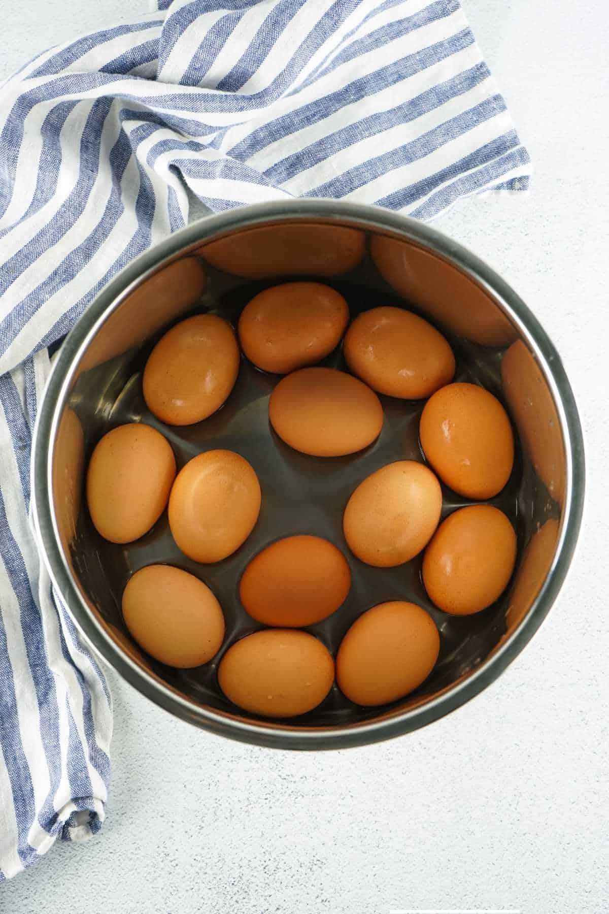 raw eggs added to an instant pot.
