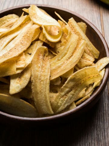 Homemade Kela or Banana chips or wafers or Plantain Chips in a bowl.