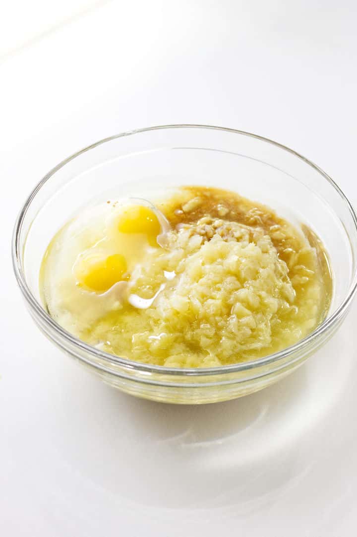 clear glass bowl with eggs, pineapple, sugar, and oil