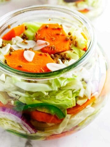 close up of jar of Mexican pickled vegetables in a jar.