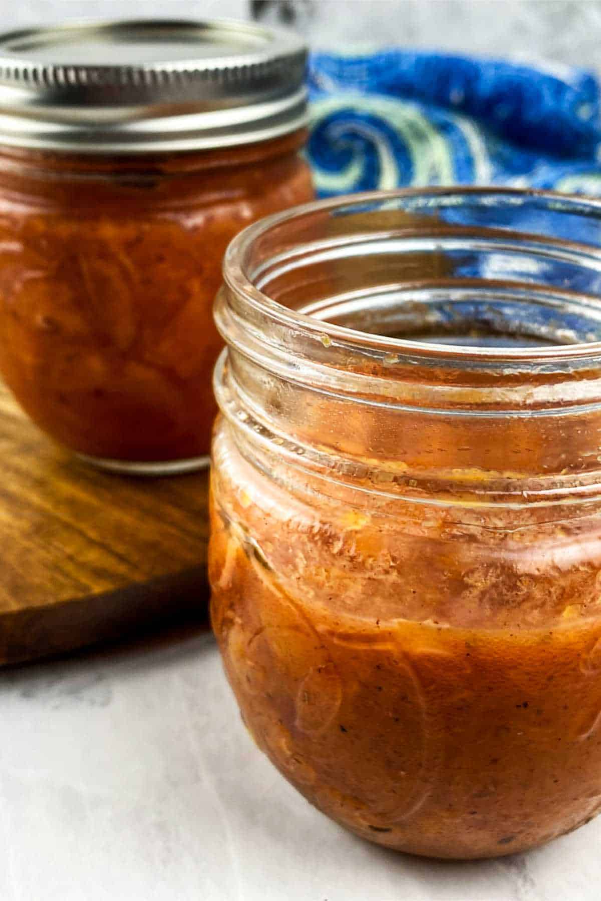 Savory peach compote in canning jar.