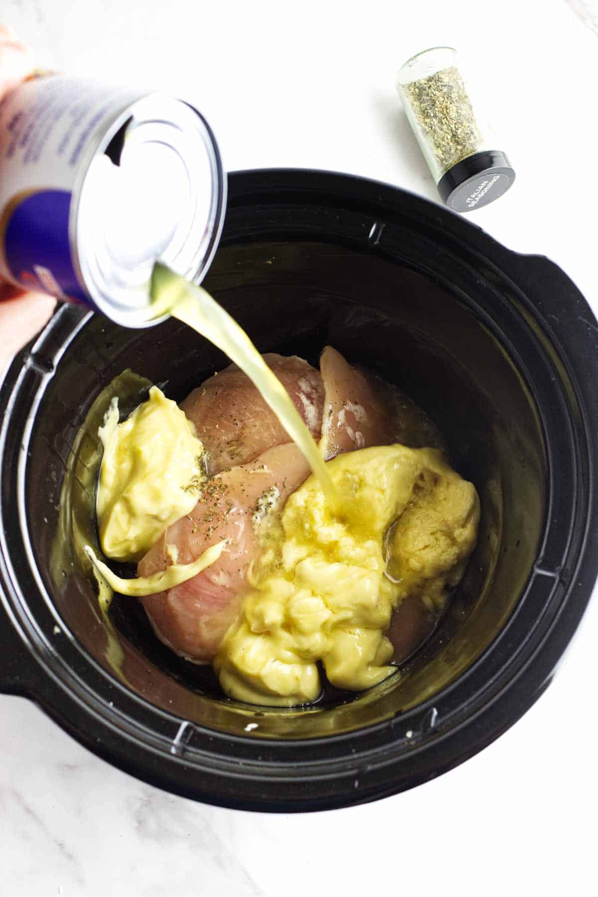 soup and broth in a crockpot on top of thighs or breast meat.