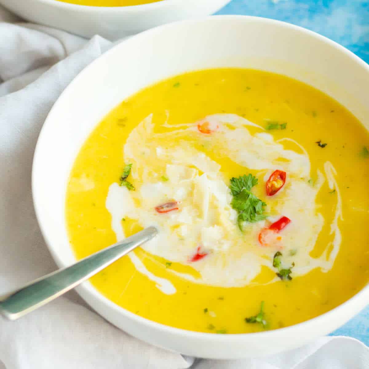savory butternut squash soup in serving bowls.