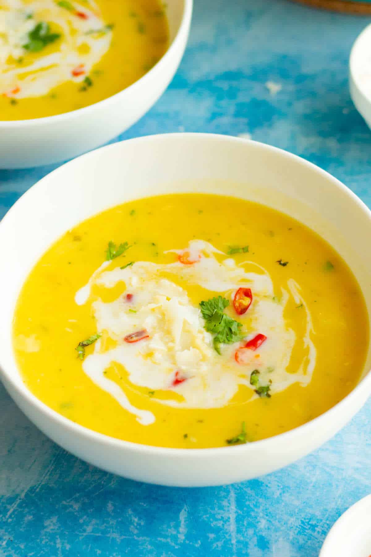 savory butternut squash soup in serving bowls.