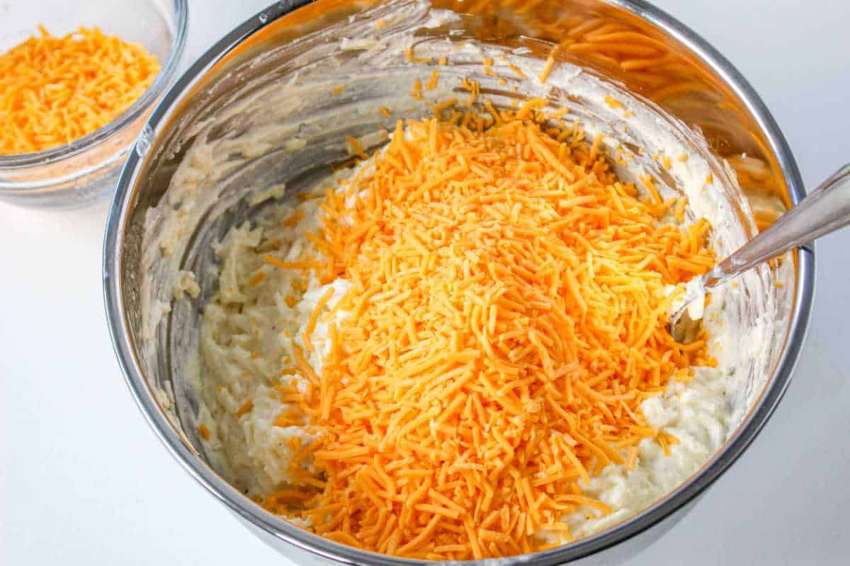 shredded cheddar added to mixing bowl.