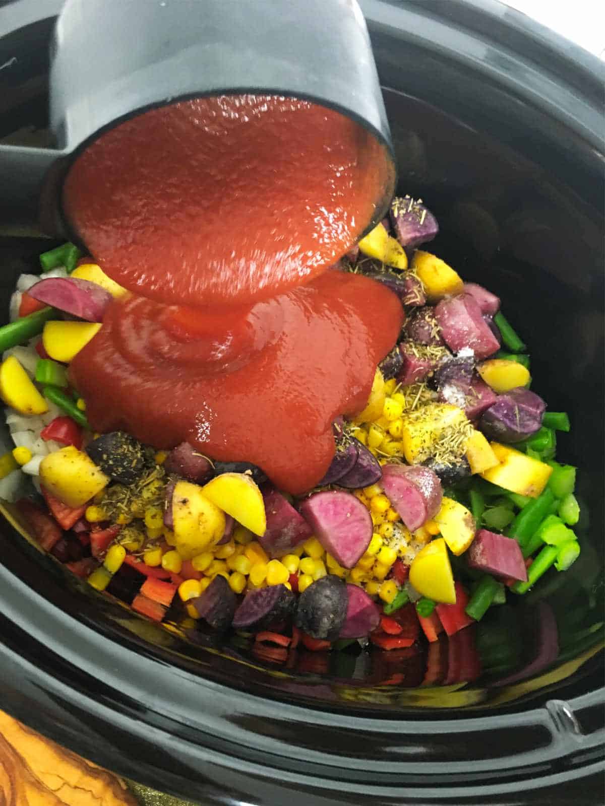 tomato sauce added to crockpot.