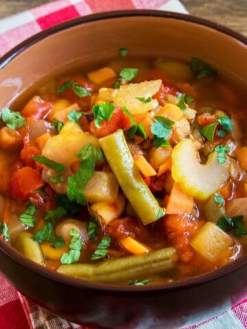 slow cooker vegetable soup in a serving bowl.