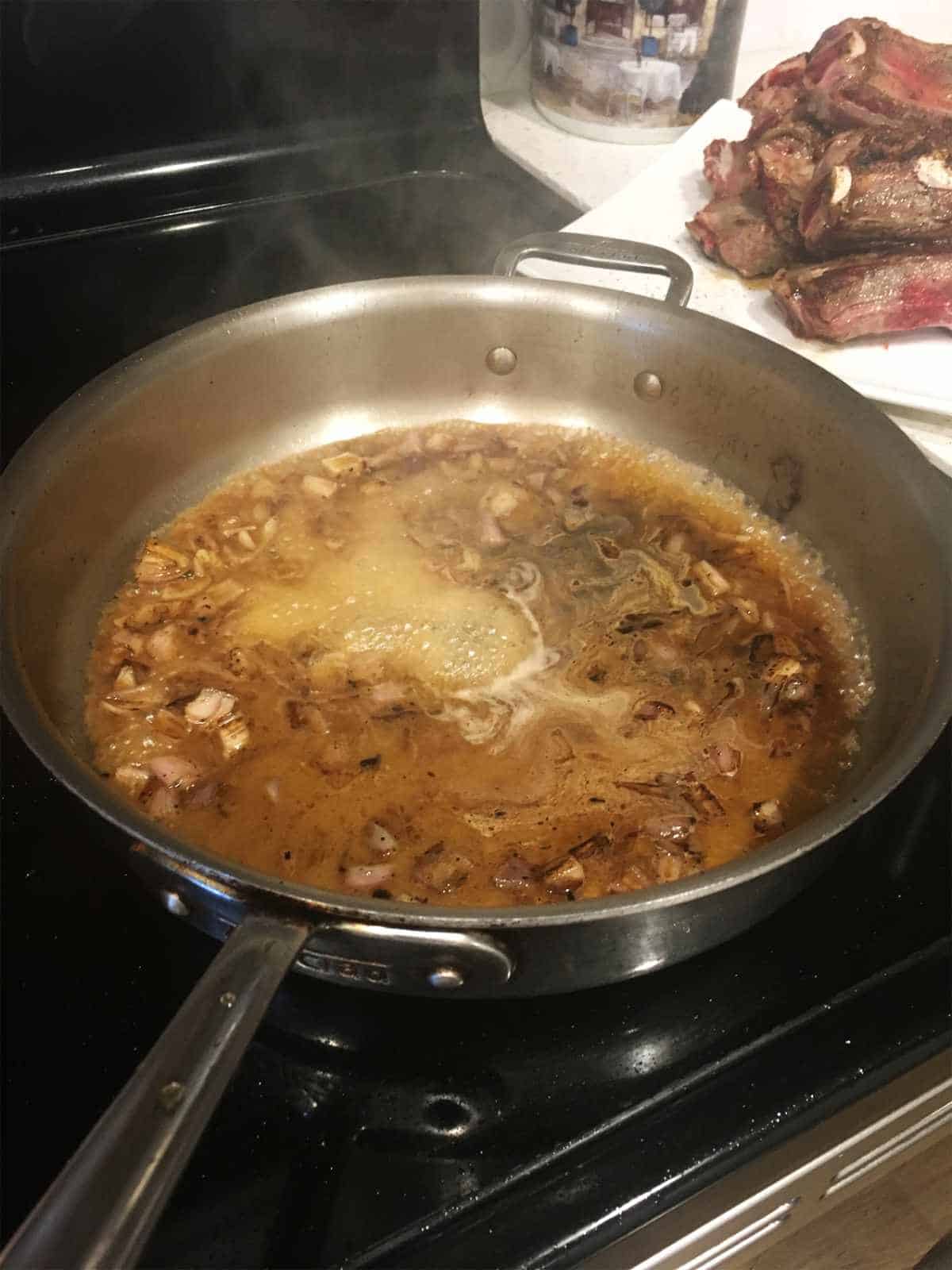 making pan gravy in skillet with onions.