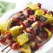 white platter with grilled kabobs