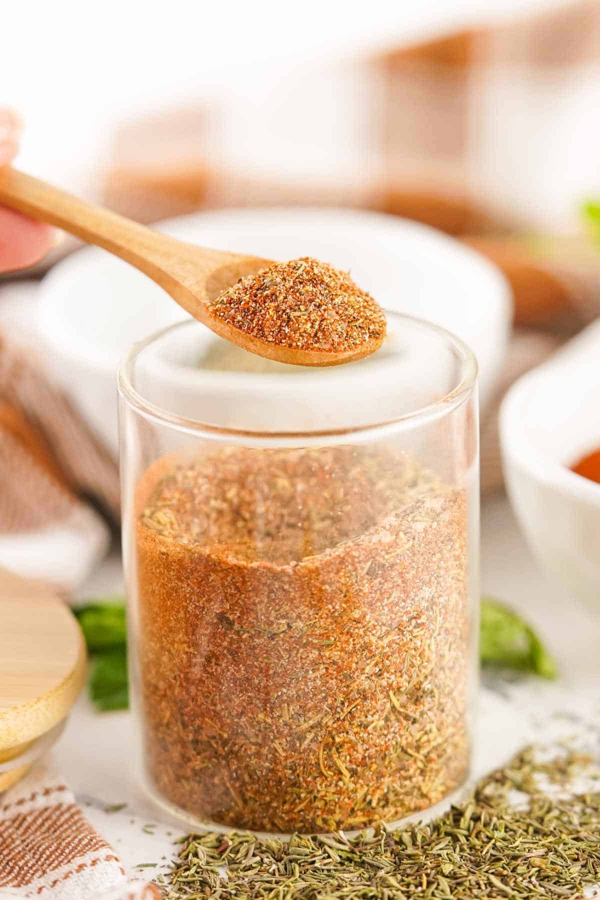 wide mouth spice storage jar filled with turkey rub seasoning blend.