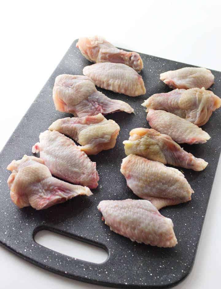 cutting board with raw poultry.