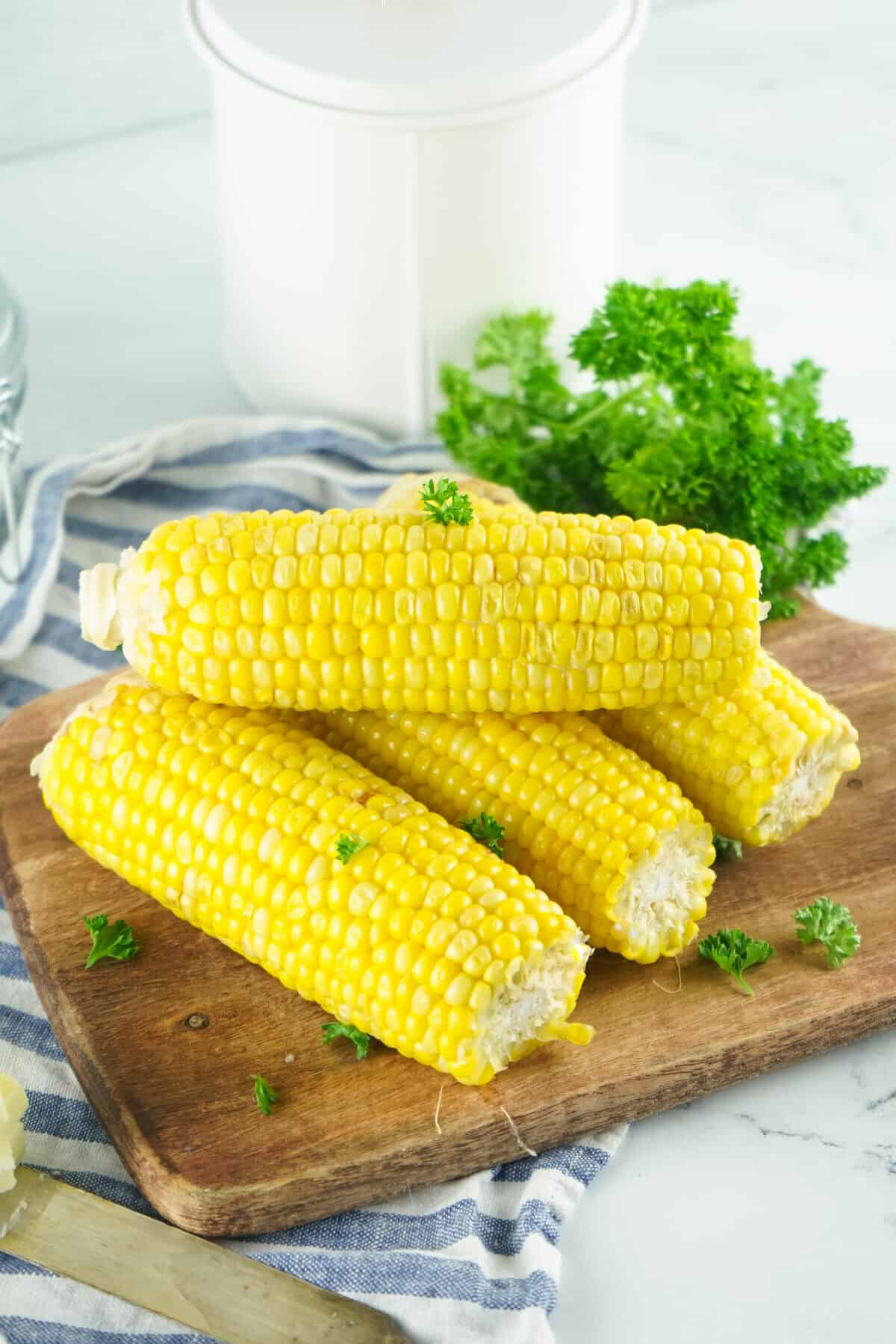 Corn on the Cob on a cutting board ready to serve.