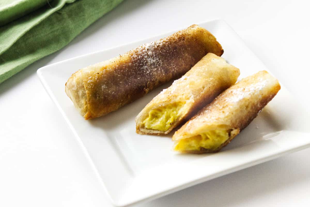 serving plate with sliced banana lumpia.