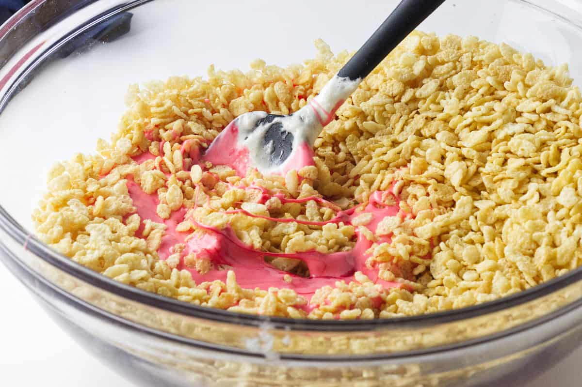 red marshmallow mixture mixed with rice crispies.