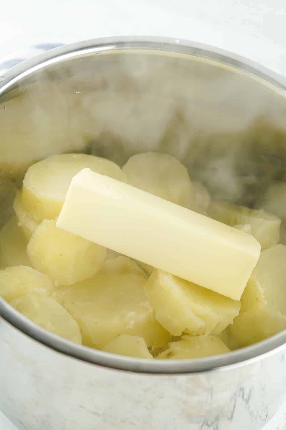 butter added to the hot, cooked potatoes.
