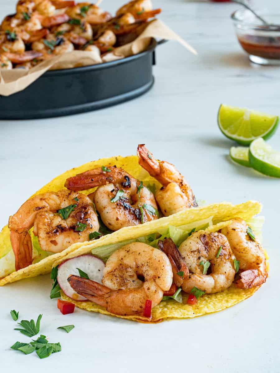 sauteed shrimp tacos with limes.