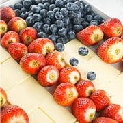 blueberries, strawberries and white cheddar on a fruit platter
