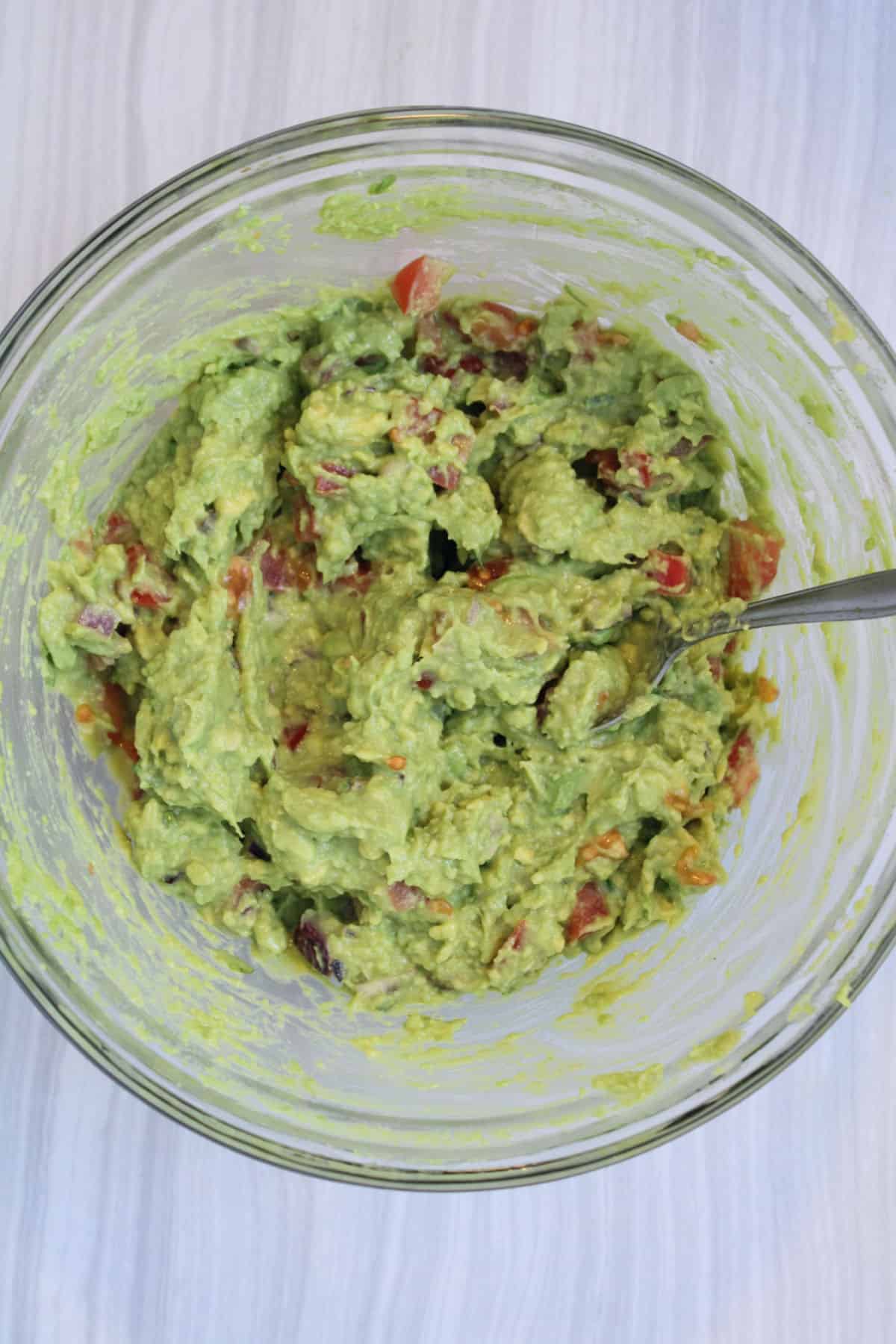 mashed avocados, onions, tomatoes, and cilantro.
