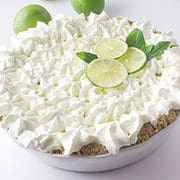 slice of no bake key lime pie on a white plate.