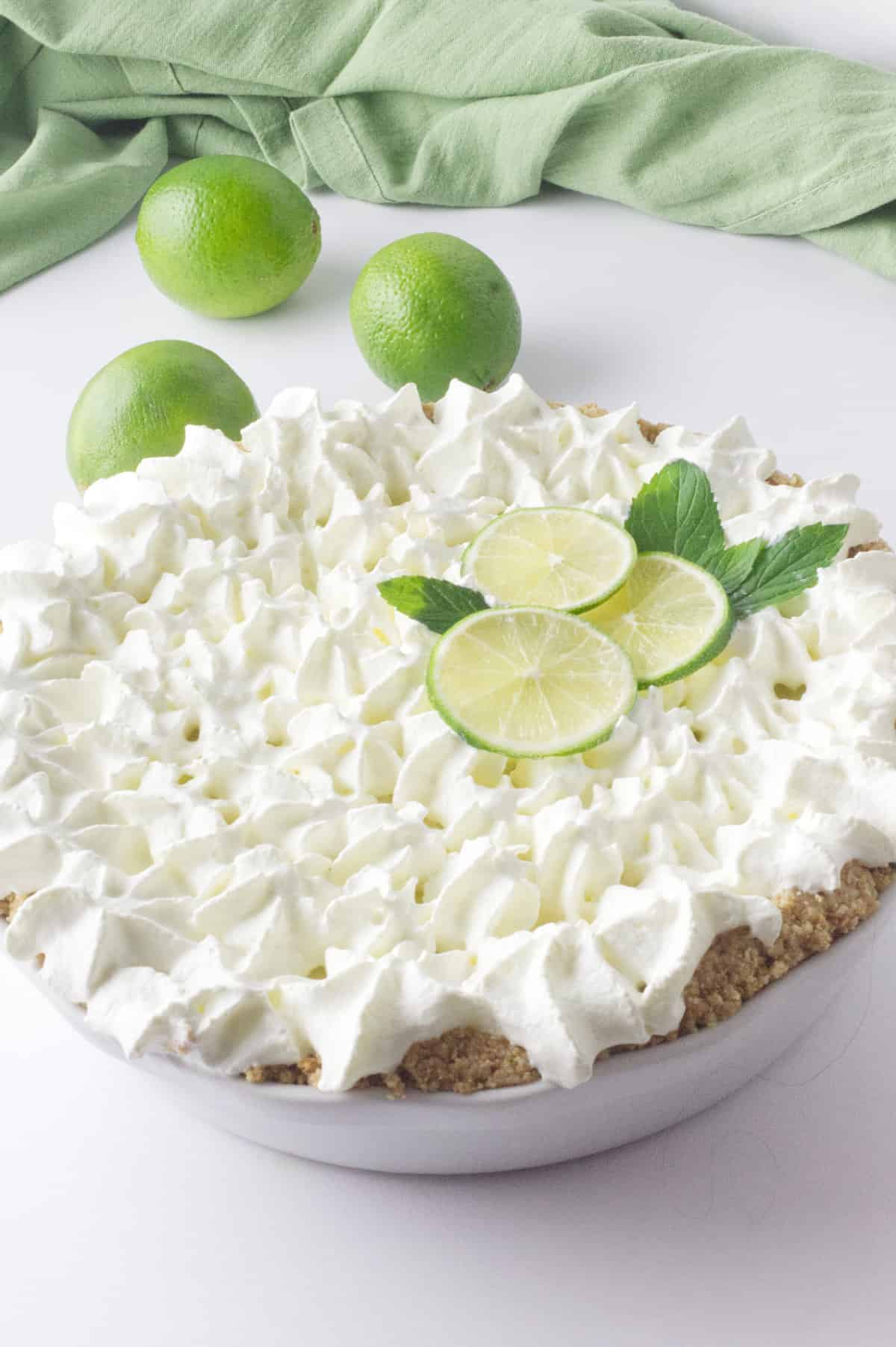 slice of no bake key lime pie on a white plate.