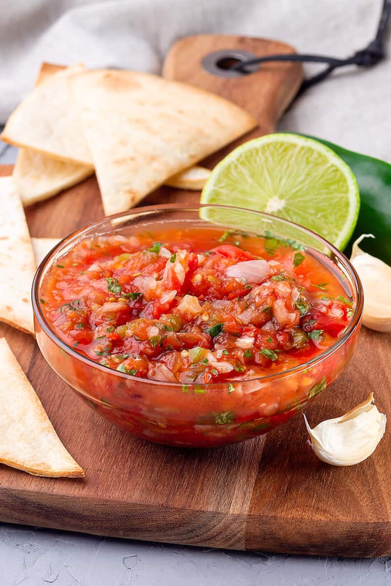 serving idea for pico de gallo, lime wedges and tortilla chips.