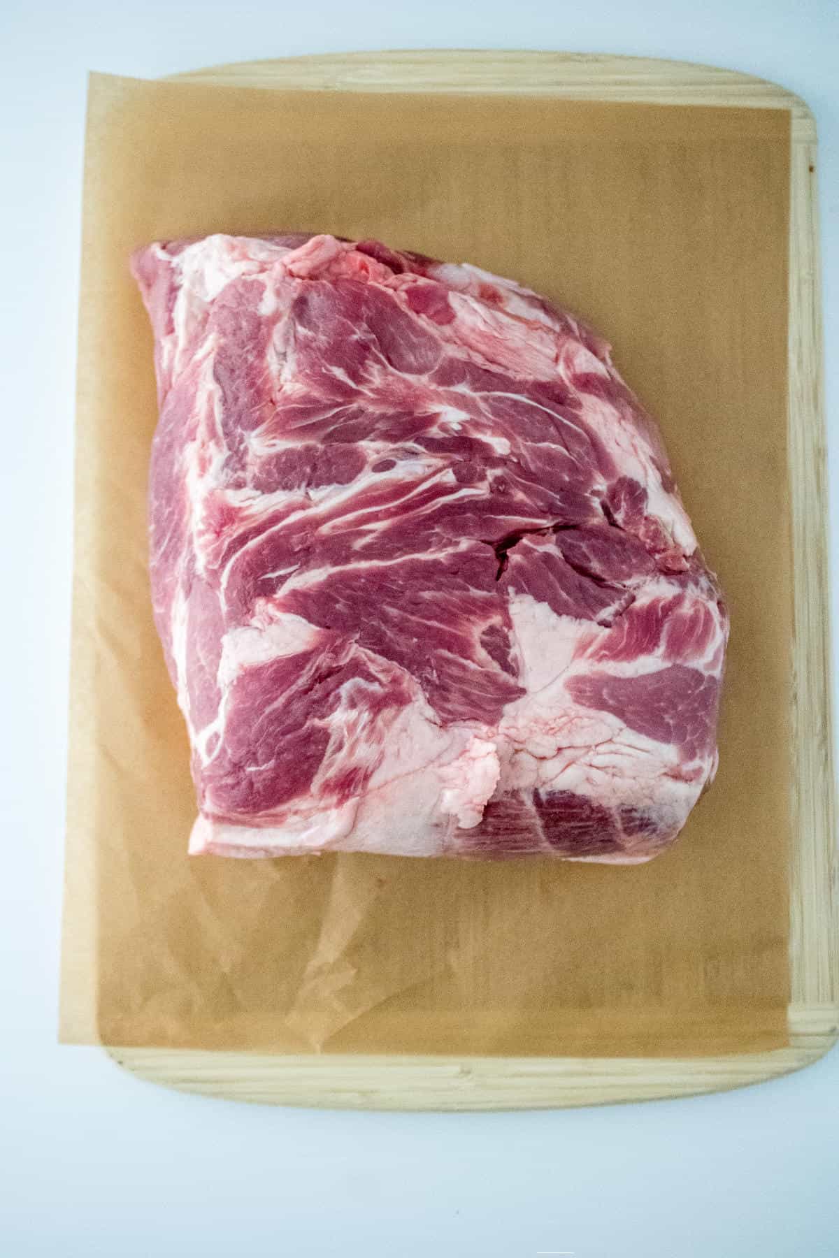 slab of pork on a cutting board.