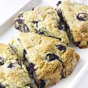 triangle cut blueberry scones sprinkled with sugar