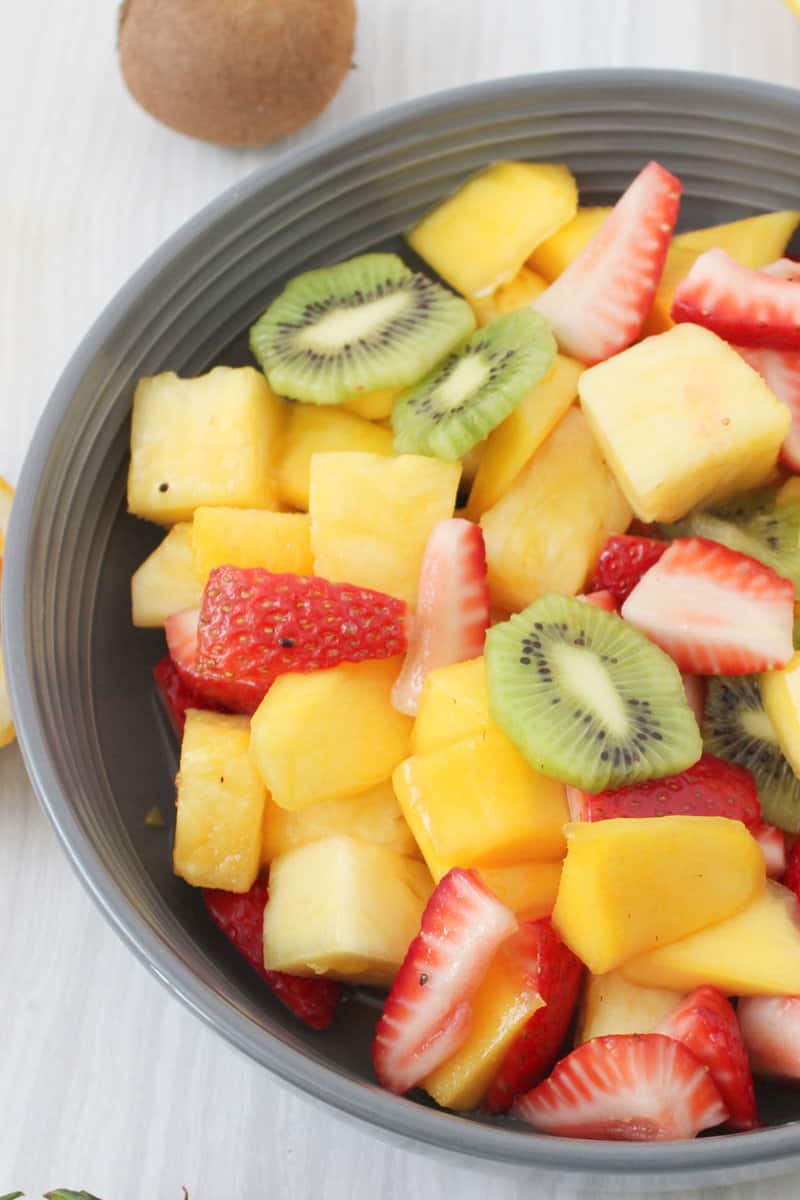 sliced tropical fruit in a bowl.