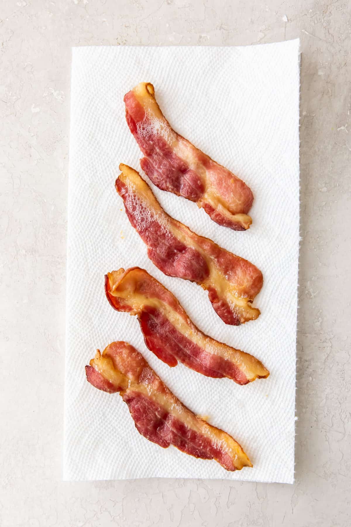 bacon cooling on paper towels.