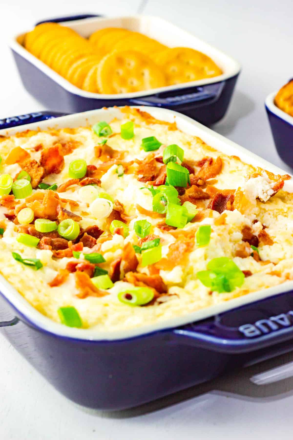 casserole dish of a cream cheese dip with bacon.