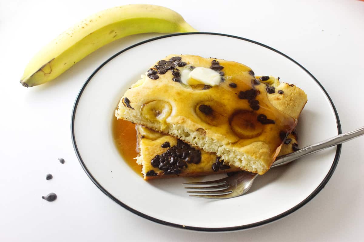 serving plate with squares of banana & chocolate chip pancake.