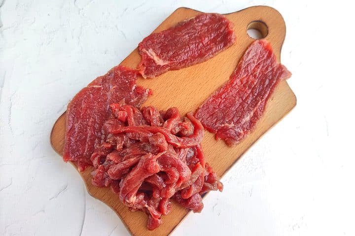 raw beef cut into strips.