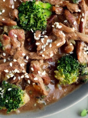 beef & broccoli stir fry in a skillet.