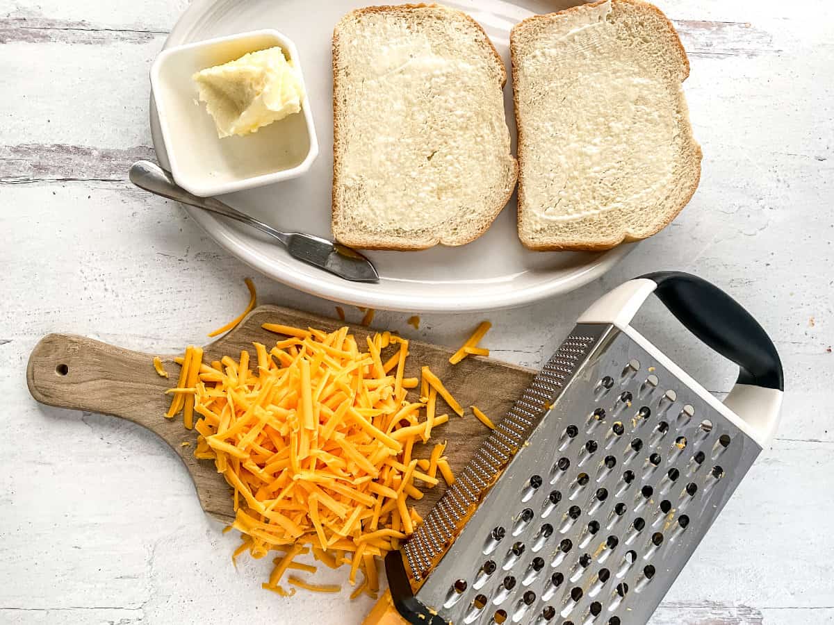 grated cheese and buttered bread.