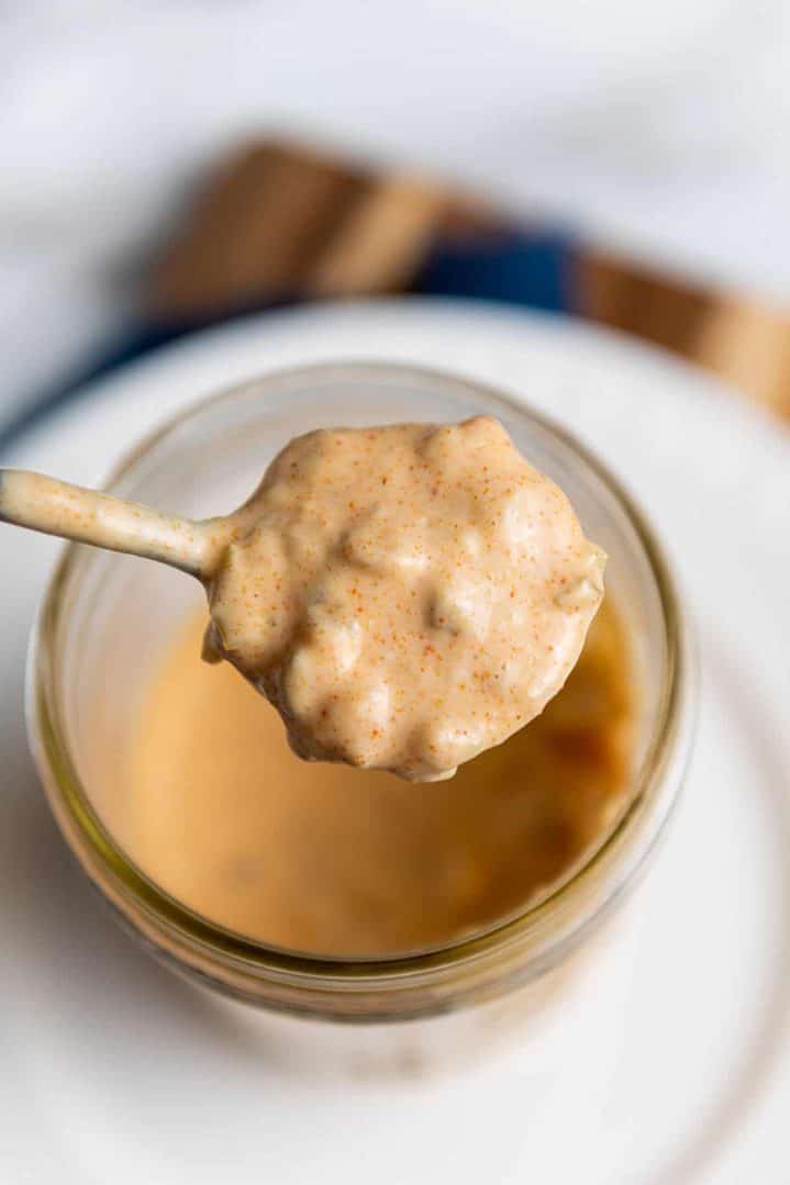 a spoonful of homemade big mac copycat sauce in a jar.