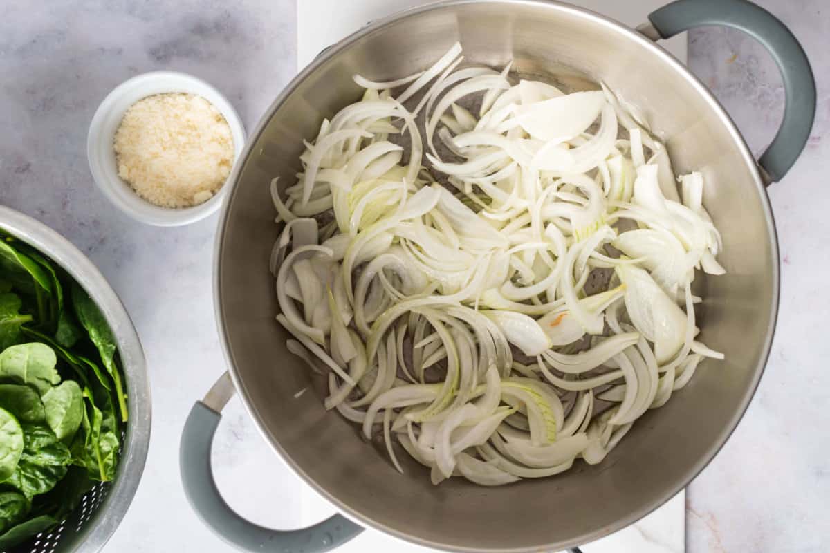 sliced onions in a pan.
