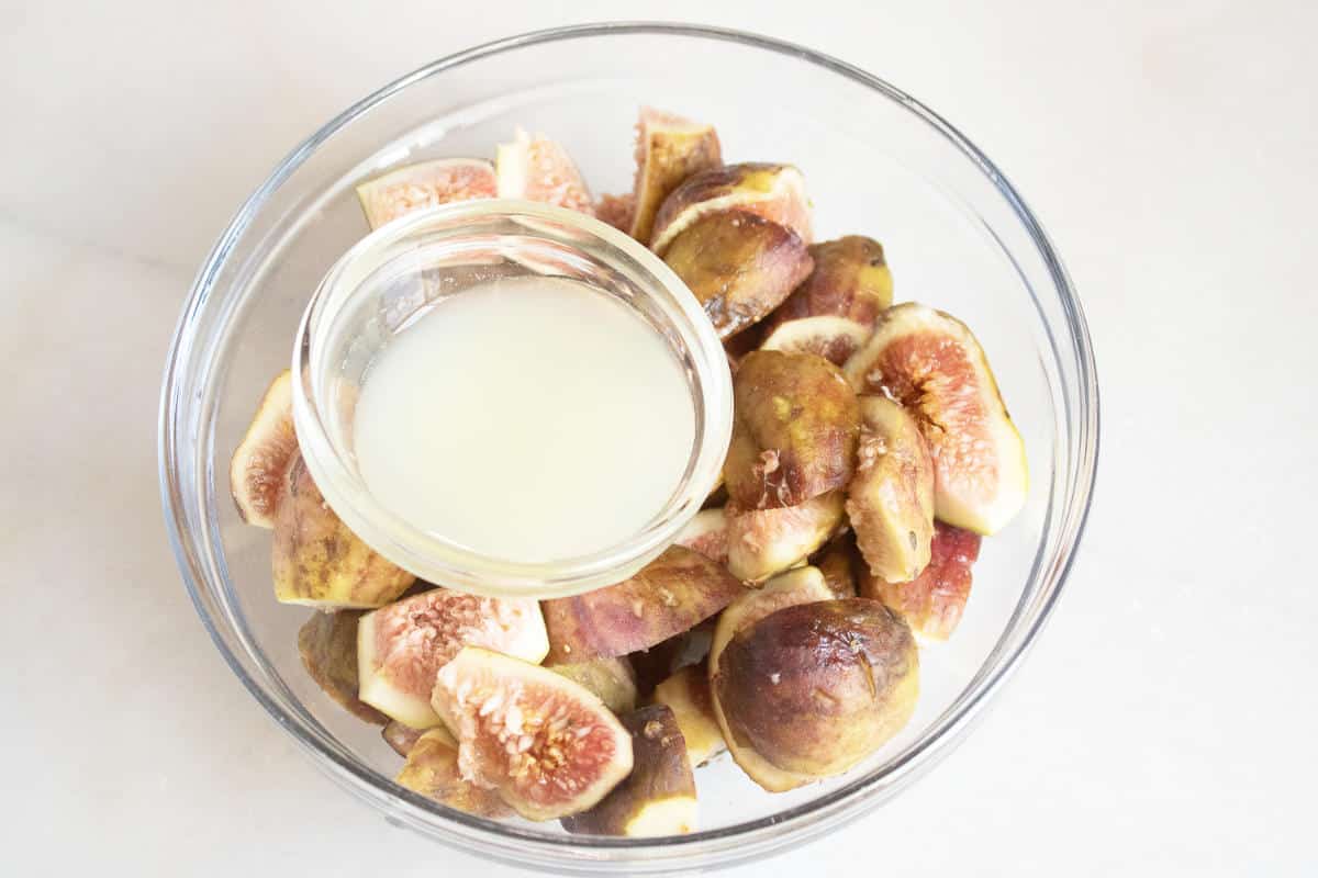 lemon juice in a bowl with figs.