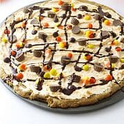 Chocolate chip cookie cake with Reeses Pieces.