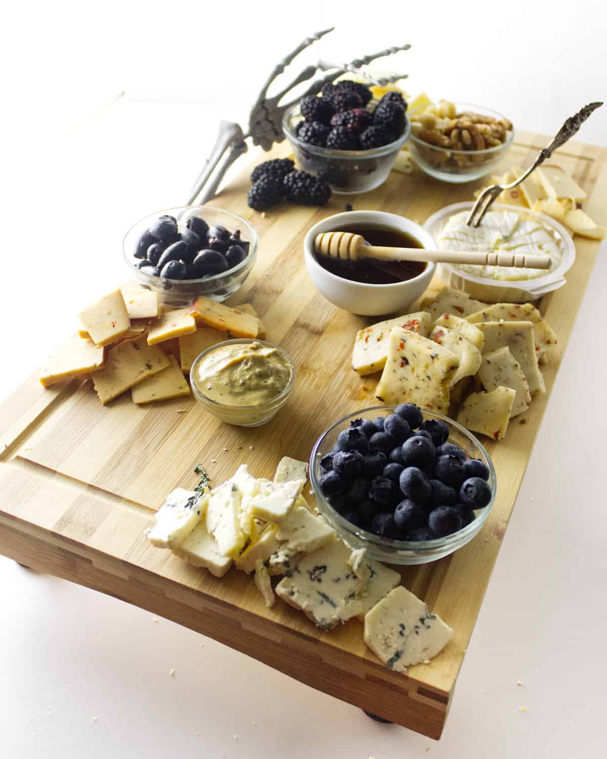 cracker and cheese added to cheese board.