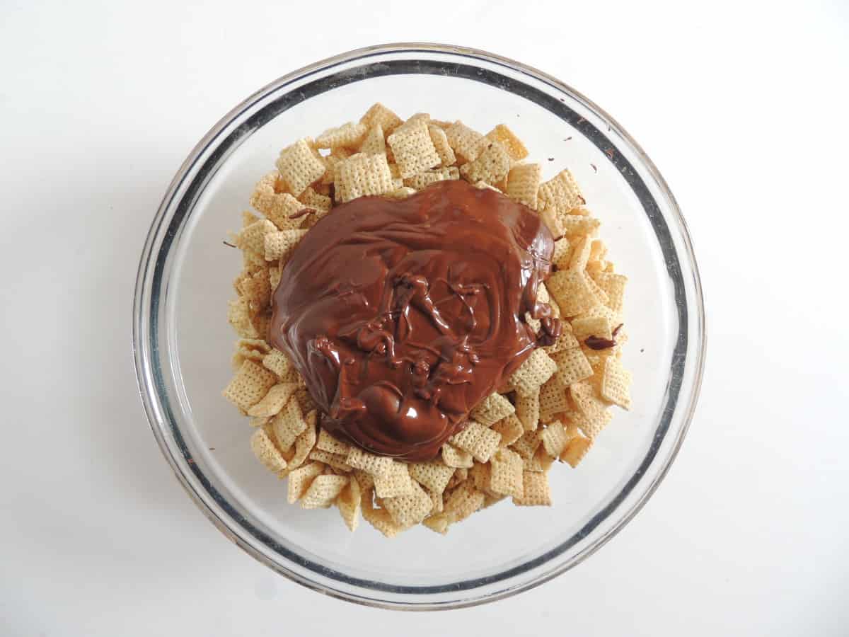 melted chocolate poured on top of rice chex.
