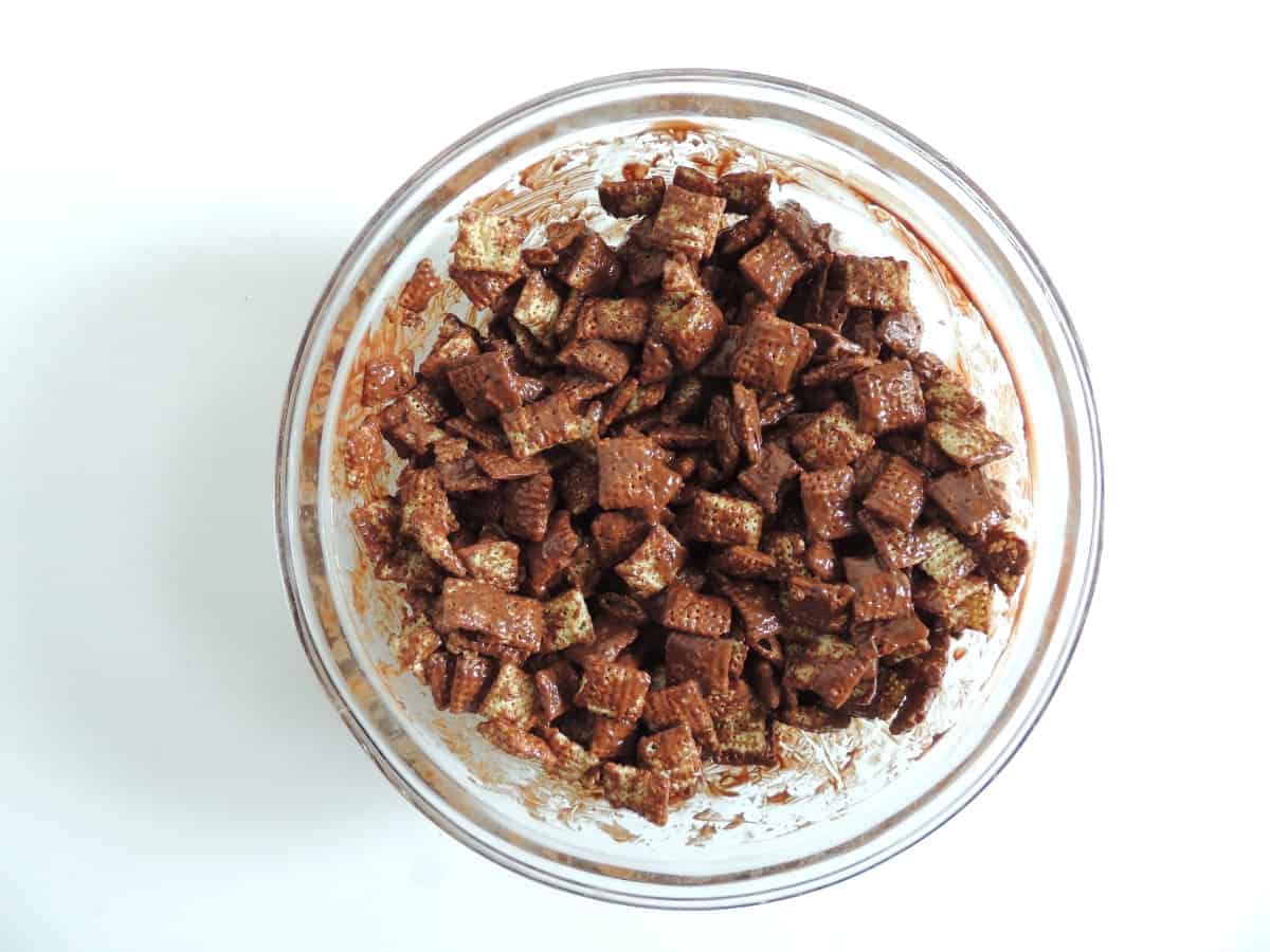 bowl of melted chocolate and chex mix.